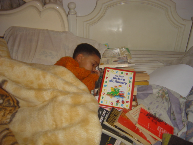 Sahil Bhatt-Sleeping with his books.Dec 2004. When he was 4 years old. Getting them into the reading habit..from a young age